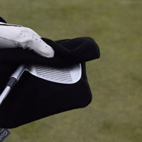 Visar hur det kan se ut när man använder Golf handduk mikrofiber på en golfklubba.